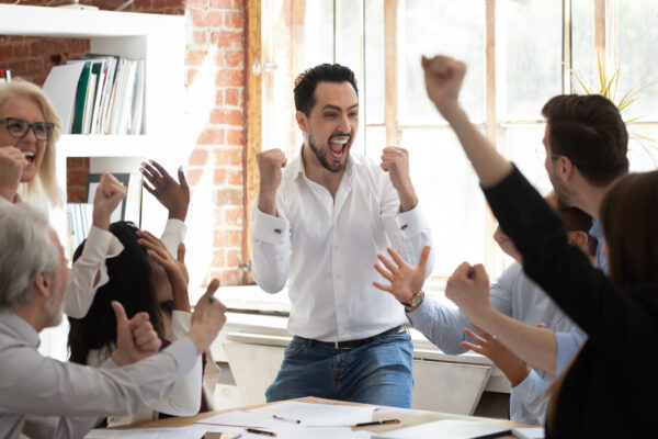 team celebrating sales job advancement