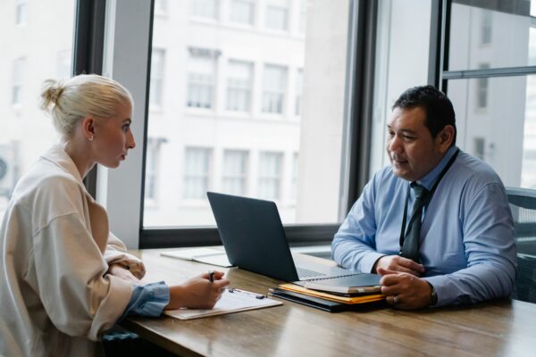 Two colleagues in the middle of a meeting.