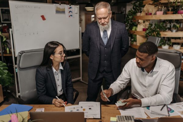 Three people having a conversation.