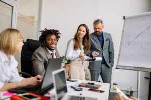 Employees in a conference room having a meeting.